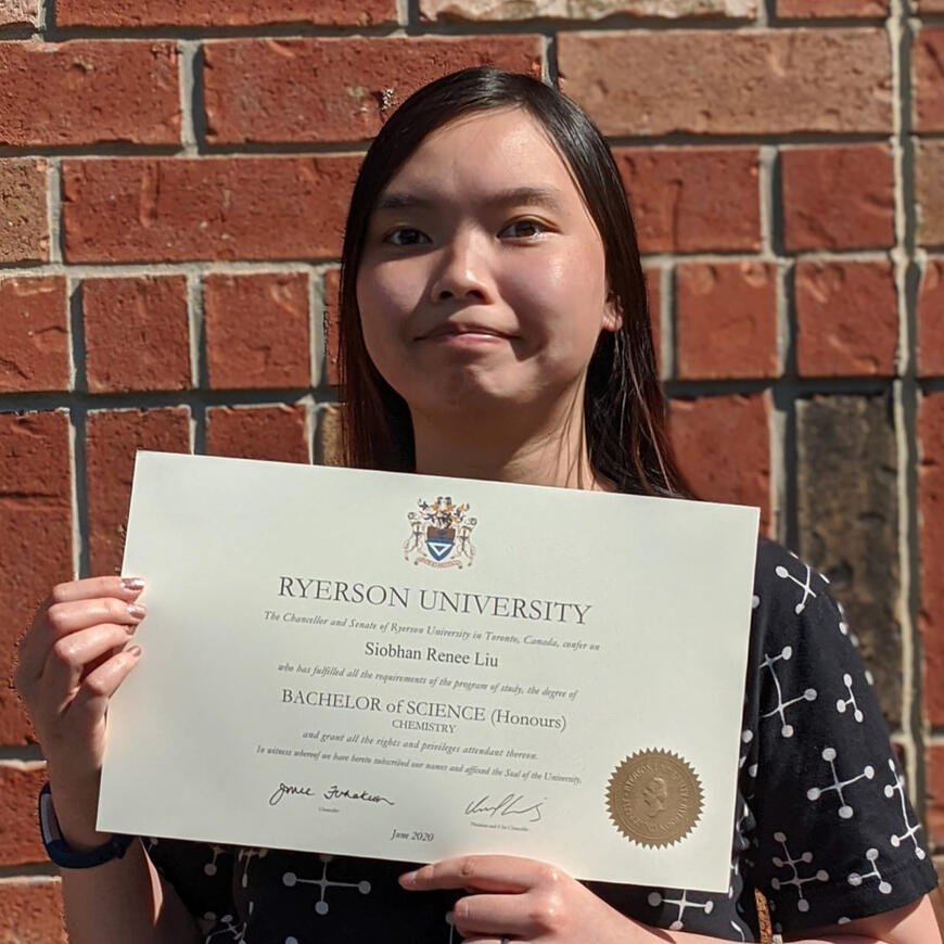 Me holding my HBSc degree